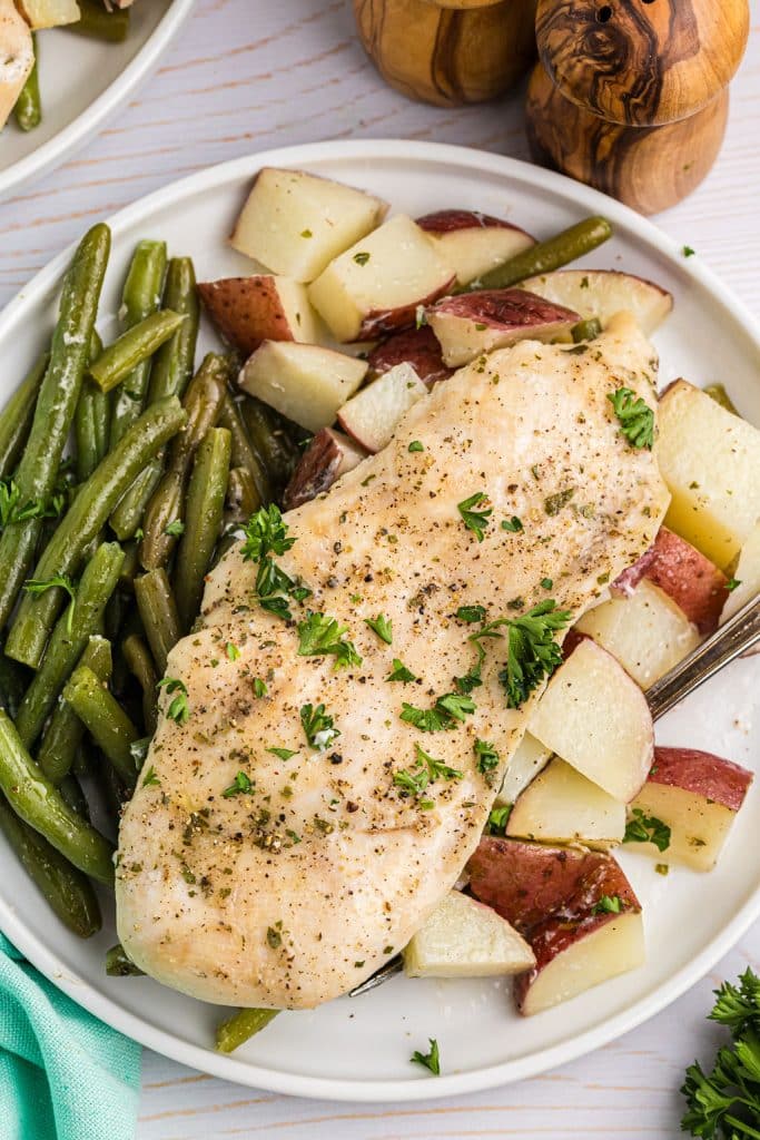 plate of baked chicken & vegetables.