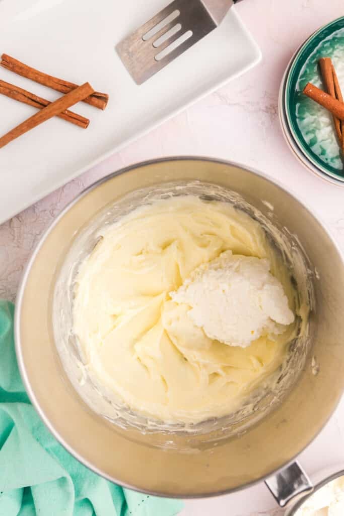 overhead shot of mixing bowl with cream cheese frosting.