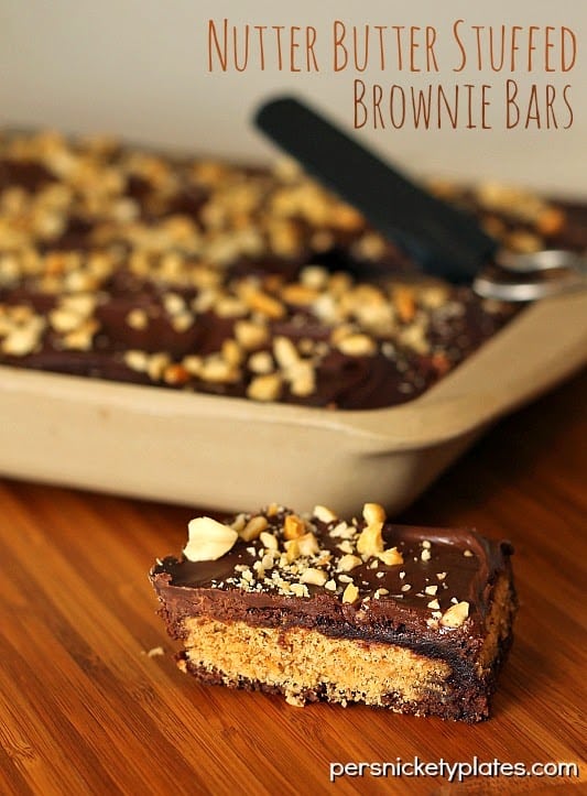 Classic brownies stuffed with Nutter Butters, frosted, then sprinkled with peanuts | Persnickety Plates