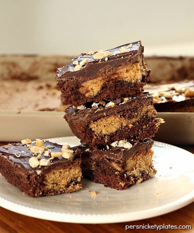 Nutter Butter Stuffed Brownie Bars Classic brownies stuffed with Nutter Butters, frosted, then sprinkled with peanuts | Persnickety Plates