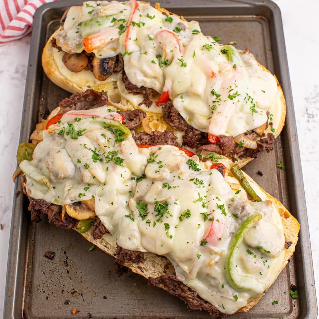 overhead shot of philly cheesesteak bread on a baking sheet.