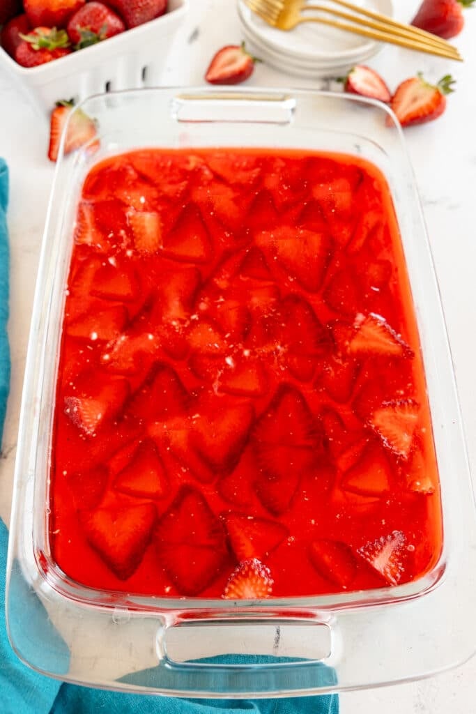 overhead shot of strawberry pretzel salad in a baking dish.