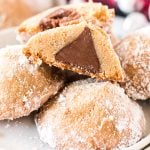 close up of a brown sugar cookie sliced in half with a Hershey's Kiss inside