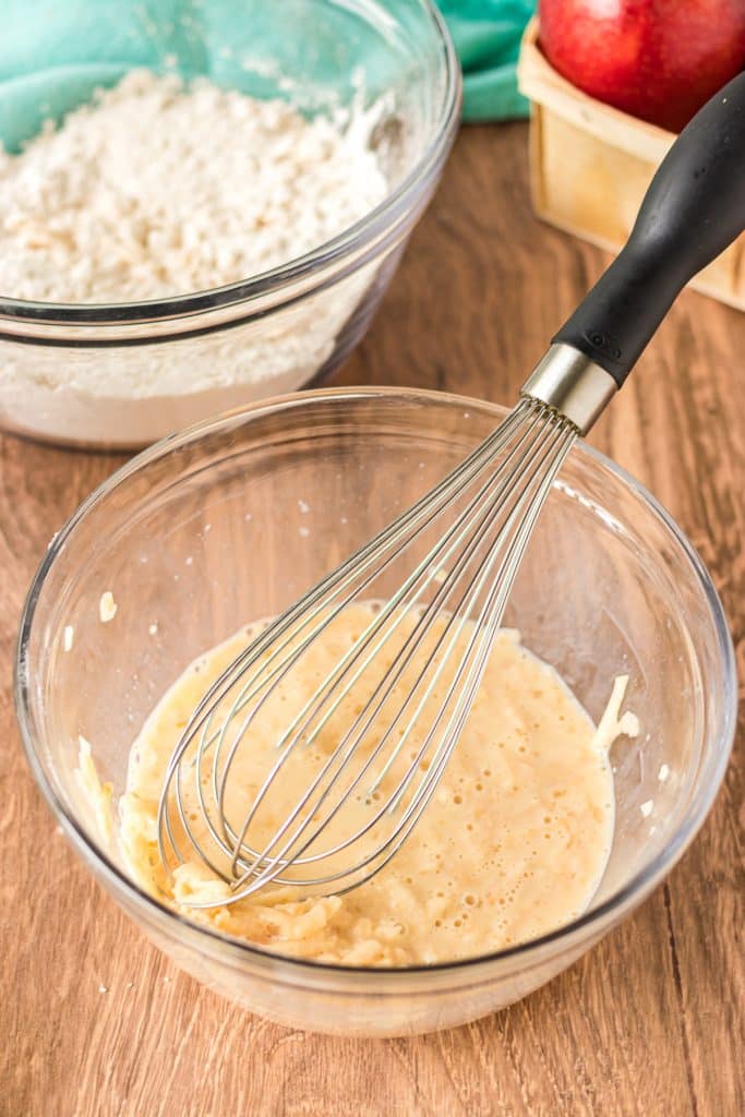 mixing bowl with a whisk in it.
