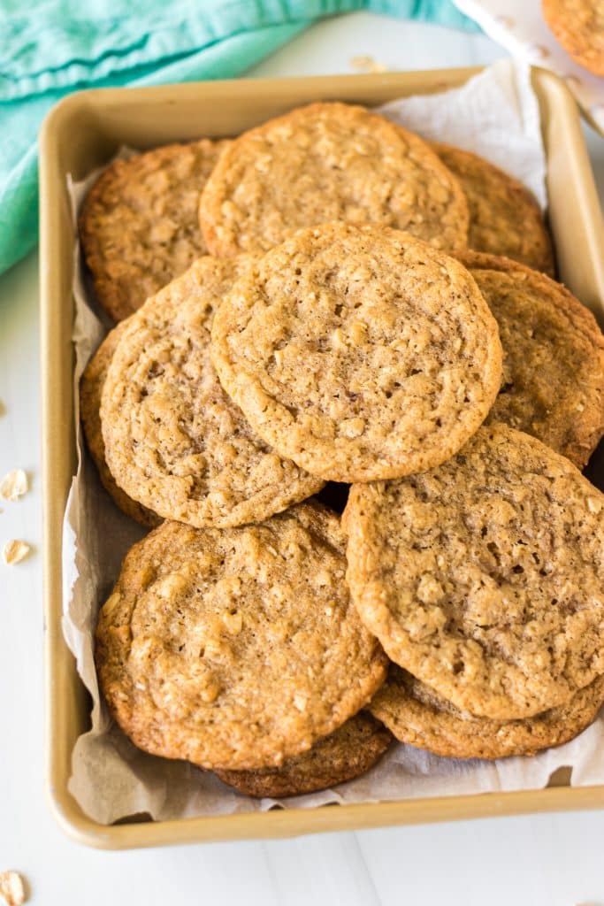 overhead shot of oatmeal cookies on a baking sheet.