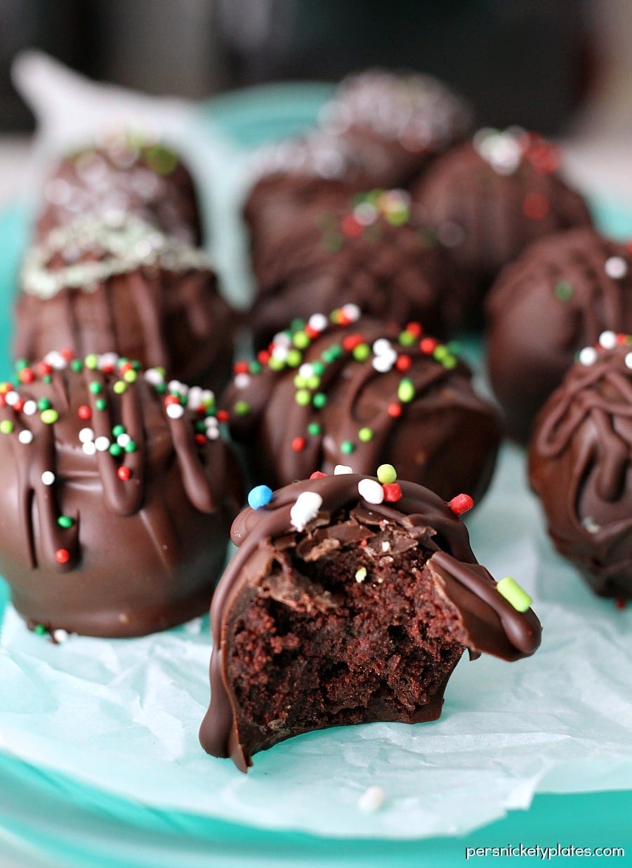 plate of chocolate bon bons with a bite taken out of one