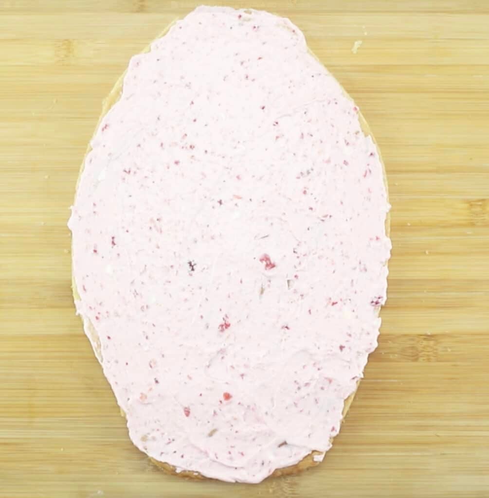 frosted sugar cookie in the shape of an egg.