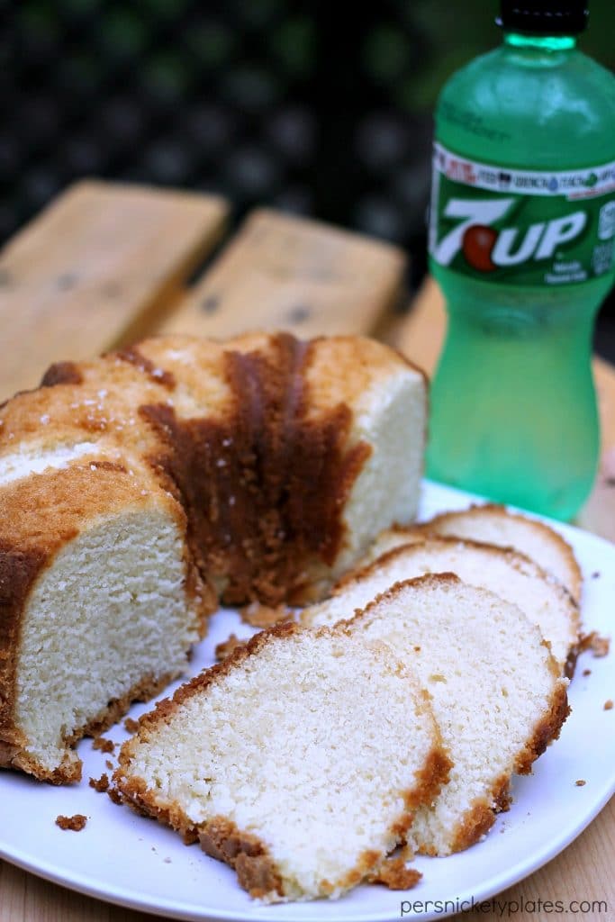 slices of 7-Up pound cake on a white plate with 7-Up bottle in the background Simple, sweet, moist - 7-Up Pound Cake has a mild citrus flavor and a a moist crumb. This classic pound cake is easy to make and a sure crowd pleaser. | www.persnicketyplates.com
