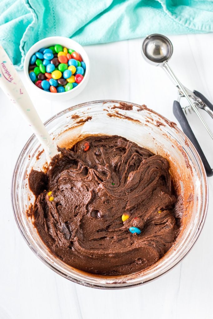 overhead shot of chocolate cookie dough in a mixing bowl.