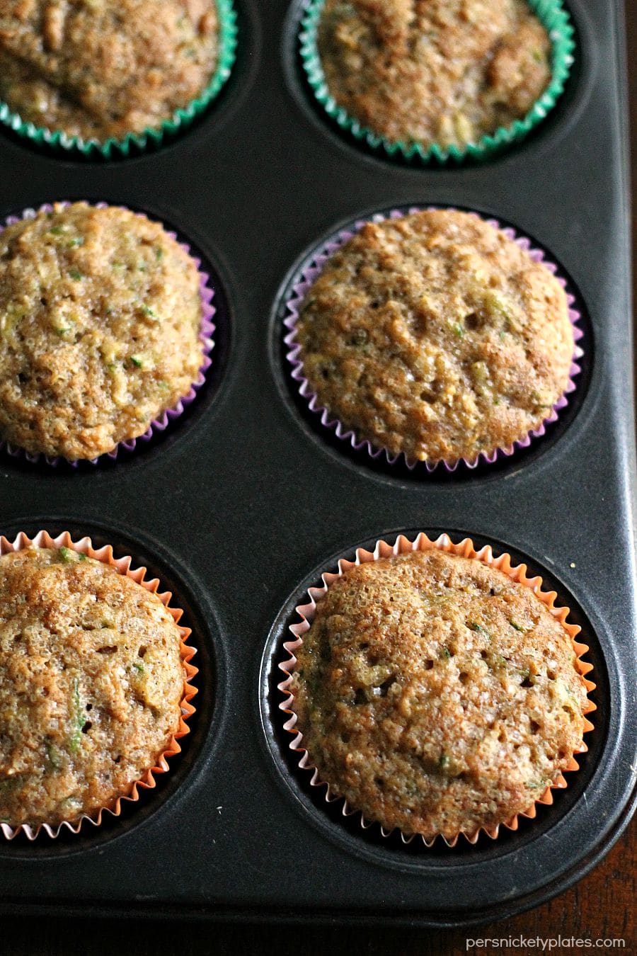 overhead shot of pan of apple zucchini muffins.
