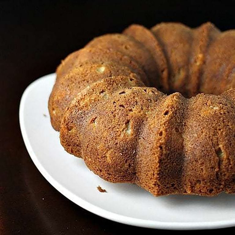 apple bundt cake on white platter