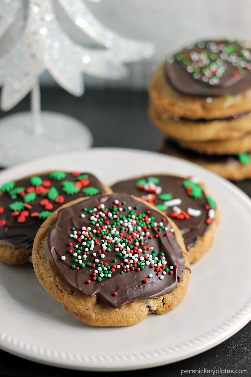 A brown butter chocolate chip cookie slathered with a layer of salted caramel then topped with chocolate and sprinkles. | Persnickety Plates