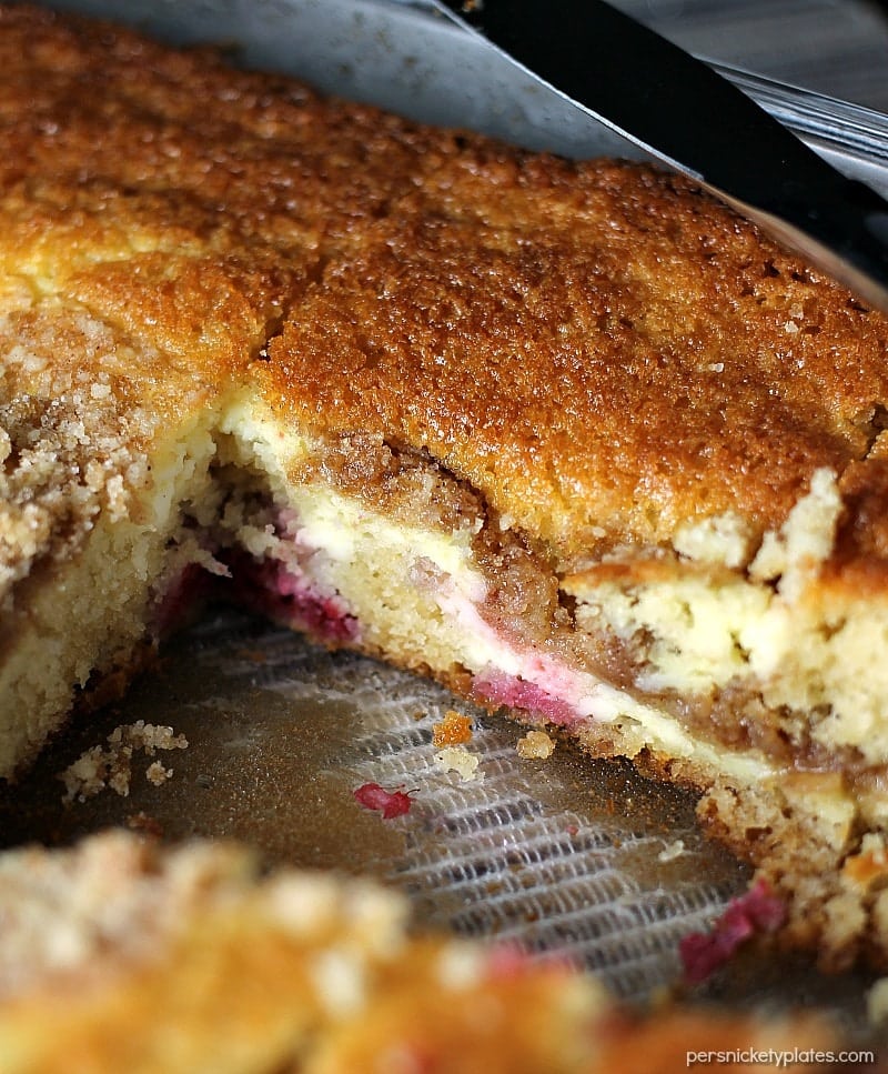 A layer of cake, a layer of raspberries and cream cheese, and a crumb topping come together perfectly in this Raspberry Cream Cheese Coffee Cake. Perfect for Mother's Day! | Persnickety Plates