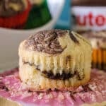 nutella muffin sitting on a cupcake wrapper.