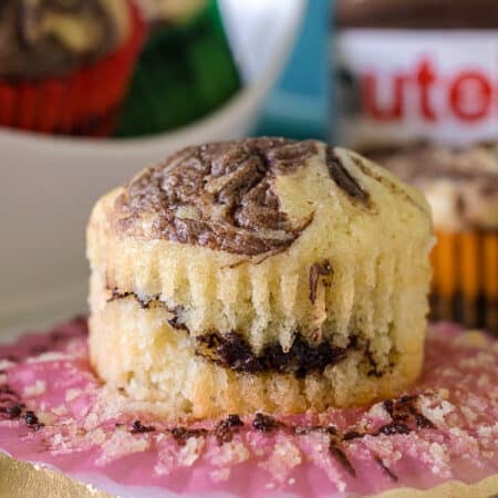 nutella muffin sitting on a cupcake wrapper.