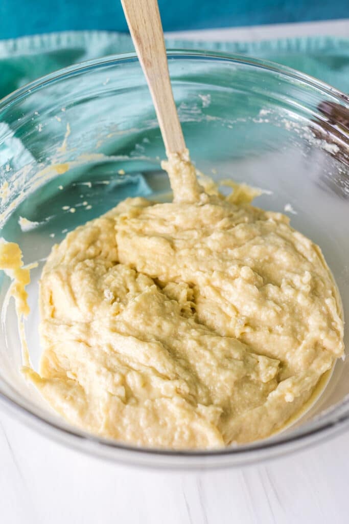 muffin batter in a glass mixing bowl.