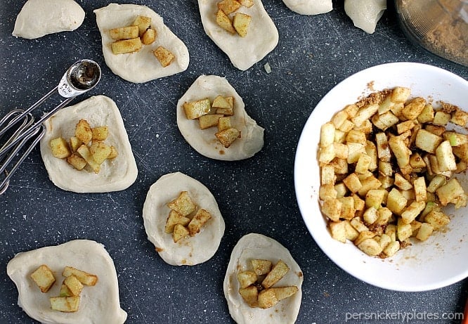 overhead shot of dough with sugared apples on top for Apple Filled Pull Apart Bread