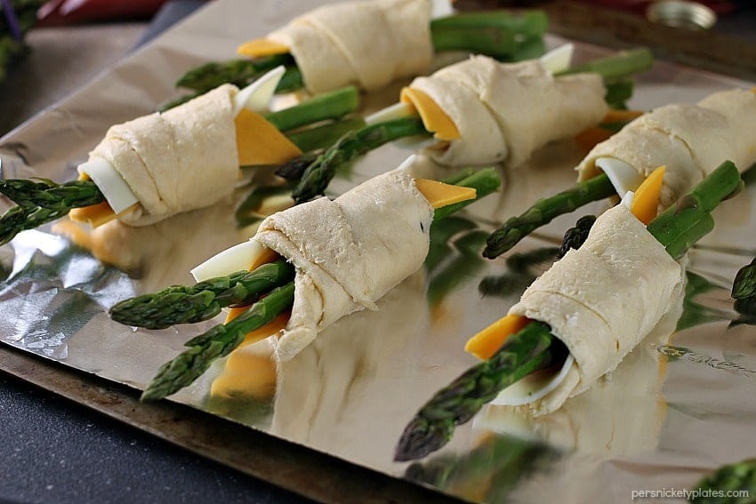 asparagus puffs prepped on a baking sheet ready for the oven