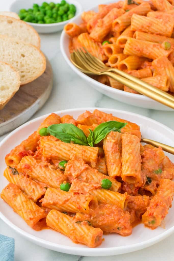plate of vodka rigatoni with bread.