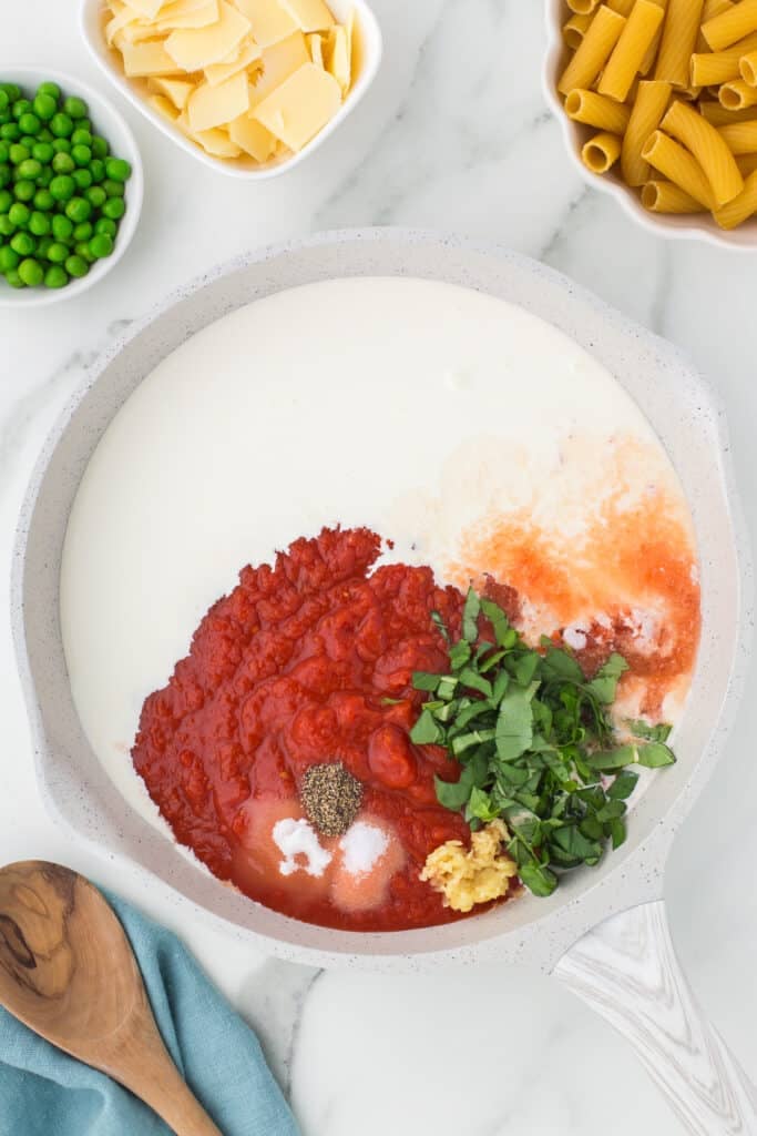 skillet with crushed tomatoes, cream, basil, and seasonings.