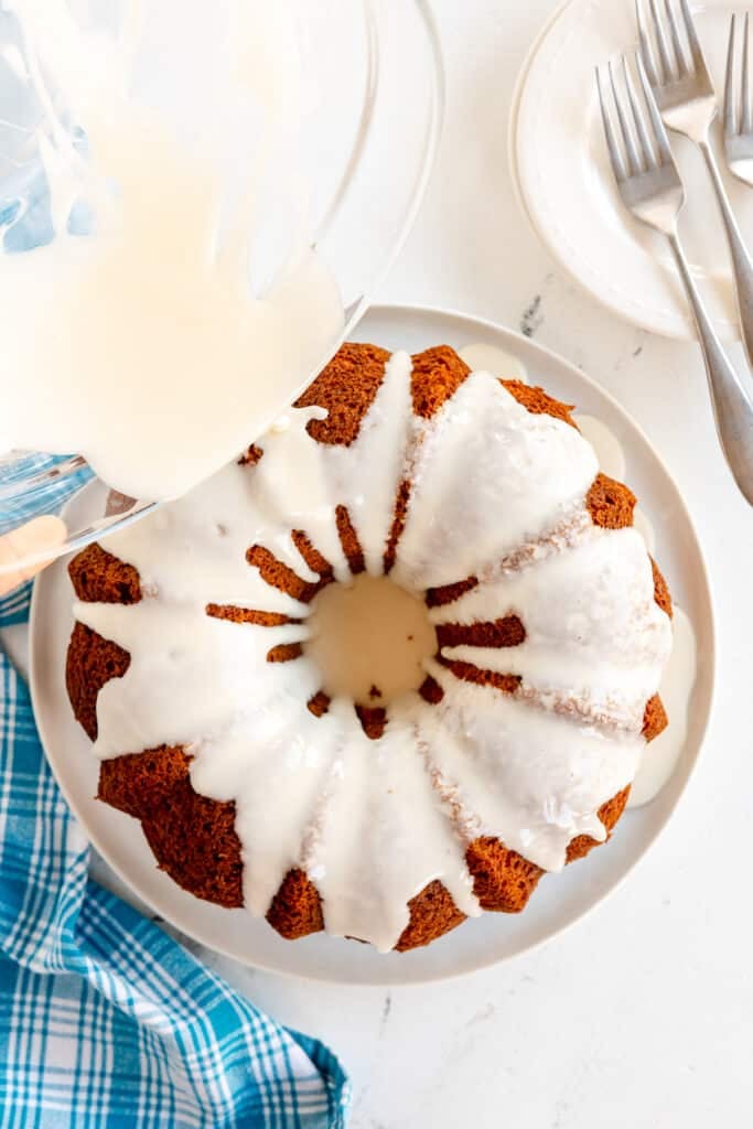 glaze pouring over a bundt cake.