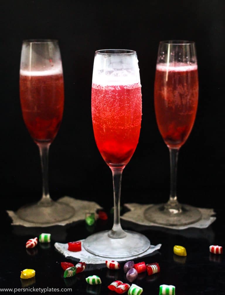 This Cranberry Prosecco Spritzer combines the vibrant bubbles of Riondo Prosecco with the warm winter notes of spearmint and cranberries. It's the perfect accompaniment to wrapping gifts and spending time with family and friends around the fire or in the kitchen. | www.persnicketyplates.com
