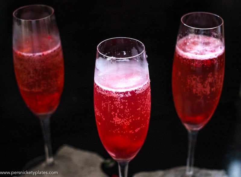 This Cranberry Prosecco Spritzer combines the vibrant bubbles of Riondo Prosecco with the warm winter notes of spearmint and cranberries. It's the perfect accompaniment to wrapping gifts and spending time with family and friends around the fire or in the kitchen. | www.persnicketyplates.com
