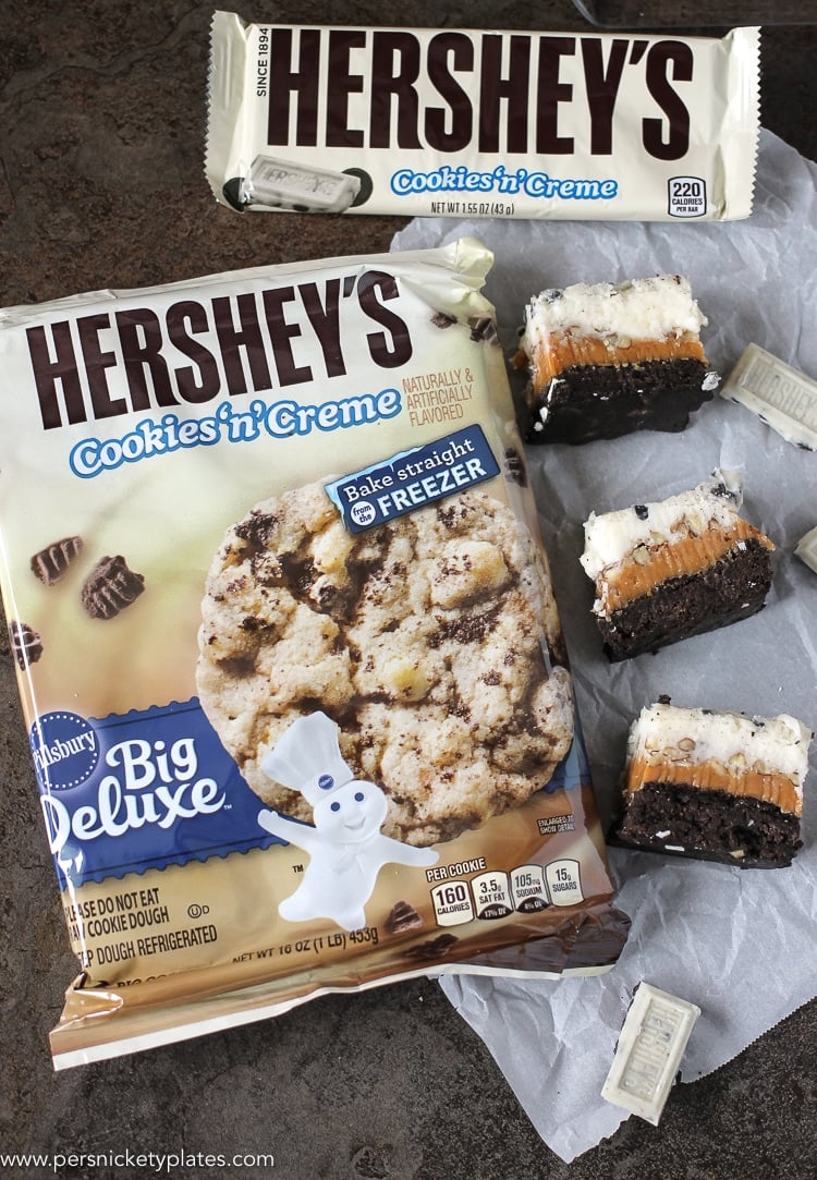 Cookies and Cream Caramel Layer Bars start with a layer of Pillsbury Cookies 'n Creme cookie dough, topped with a layer of caramel, chopped pecans, frosting, then finished with melted Cookies 'n Creme candy bars. I hope your sweet tooth is ready! hershey's cookies 'n creme refrigerated cookie dough