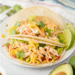 Three ingredient Crock Pot Salsa Chicken is in my regular dinner rotation because it's so easy & so good! Flavorful and versatile, this slow cooker chicken can be made into burritos, taco bowls, nachos, whatever you feel like!