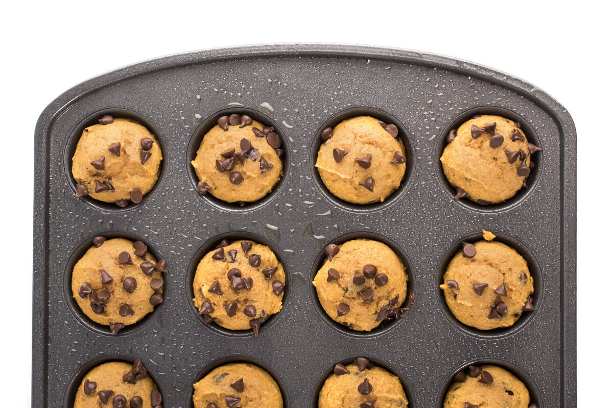 Mini Pumpkin Chocolate Chip Muffins in a muffin tin