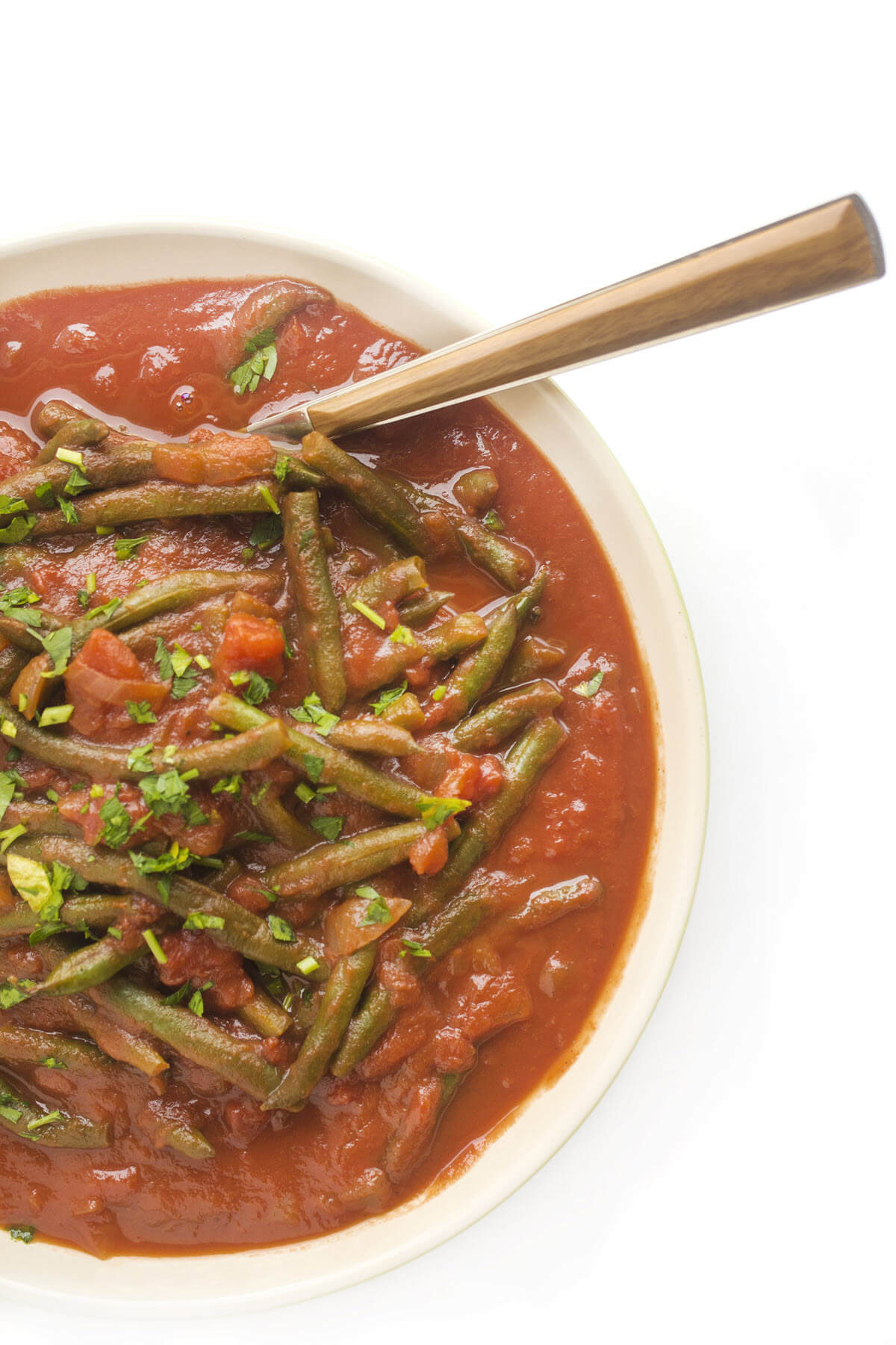 cooked green beans and tomatoes in a bowl low carb side dish