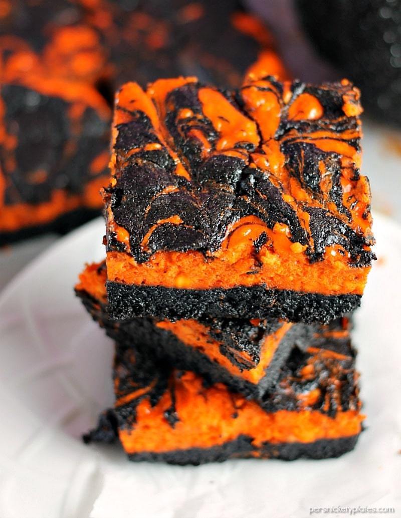 stack of black & orange halloween cream cheese swirl brownies