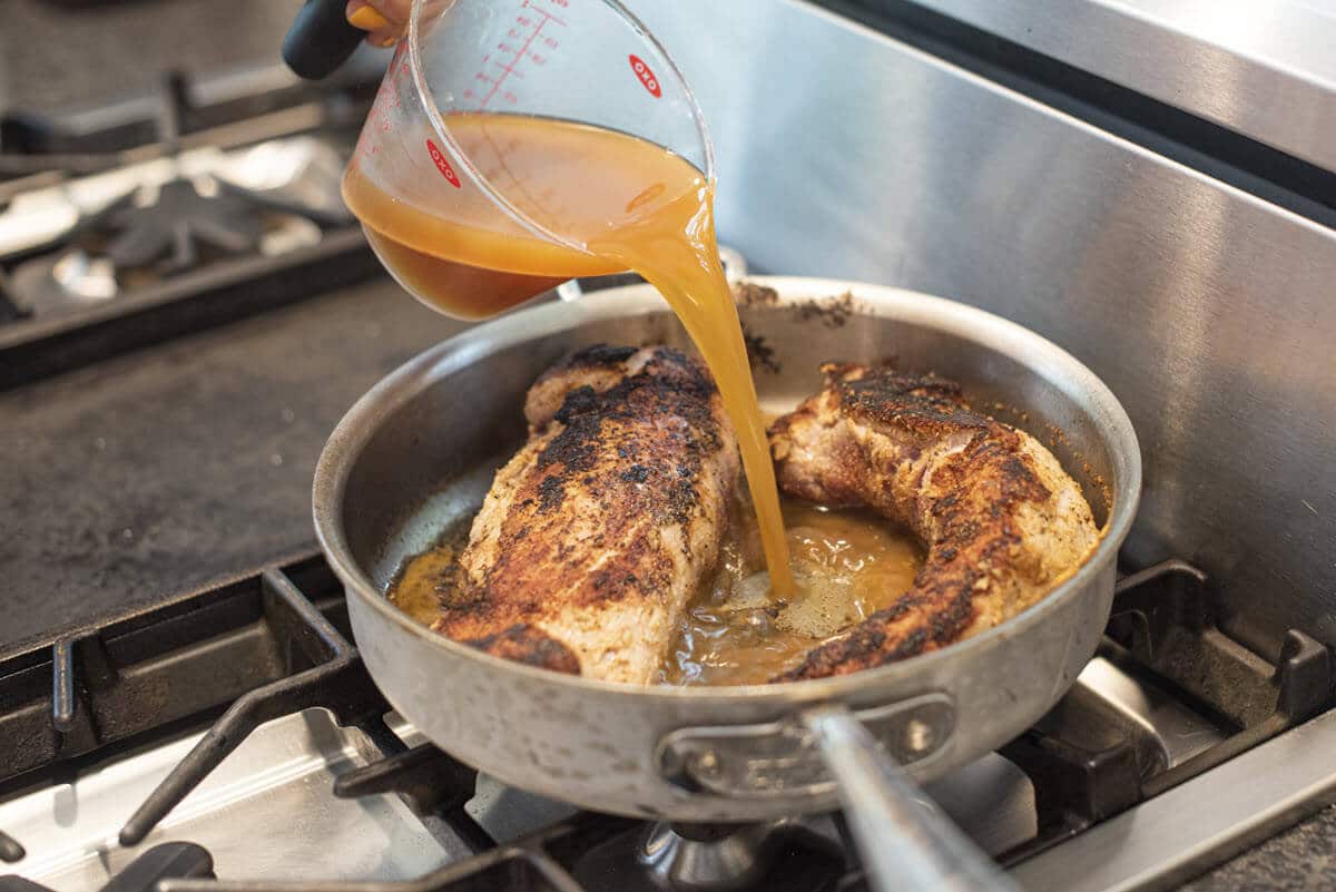 Liz Pouring Cider on Pork