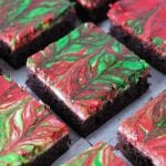 sliced red & green swirled cheesecake brownies