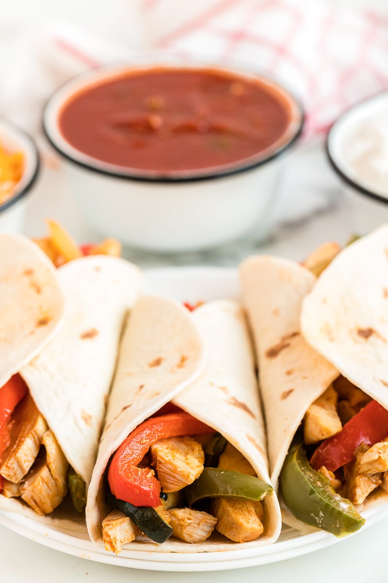 chicken fajitas on a plate with salsa