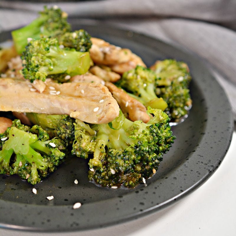 chinese chicken and broccoli on grey plate