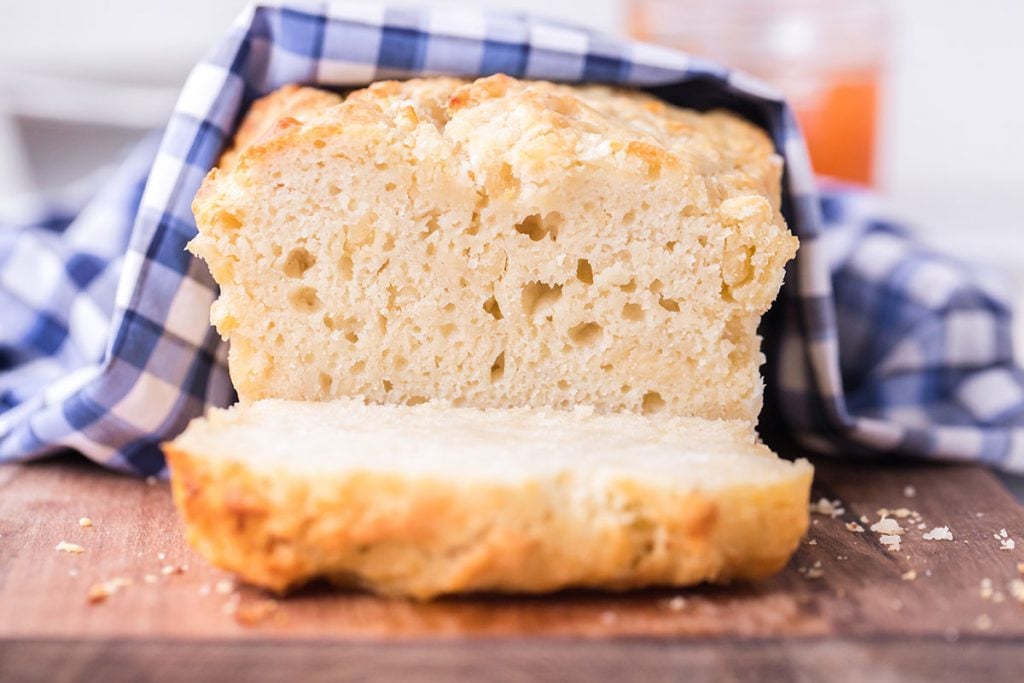 slice of beer bread with blue checkered towel