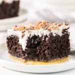 slice of better than sex cake on a white plate