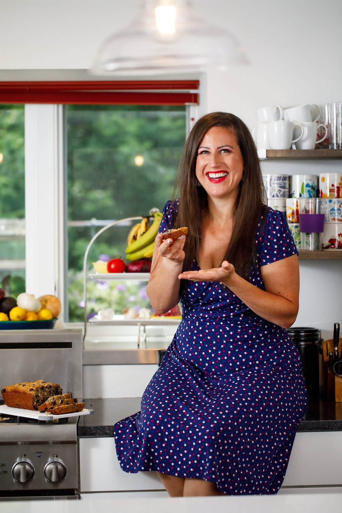 Liz holding blueberry oatmeal bread