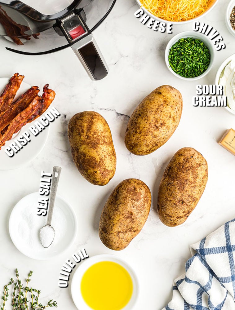 overhead shot of potatoes & ingredients to make loaded baked potatoes