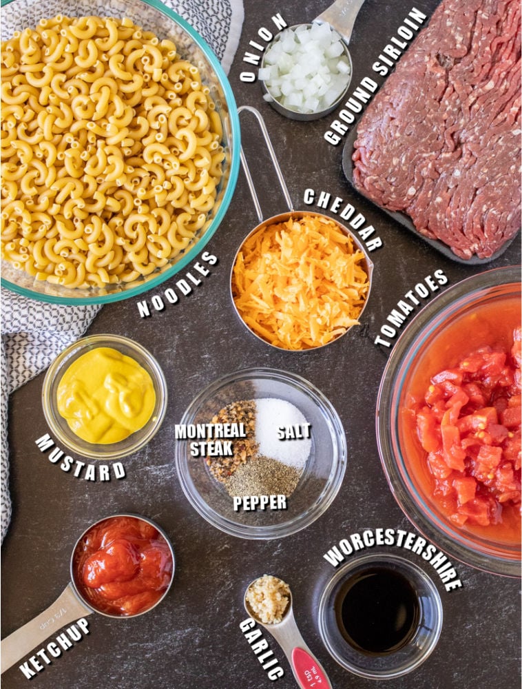 overhead shot of ingredients laid out in bowls - noodles, beef, tomatoes