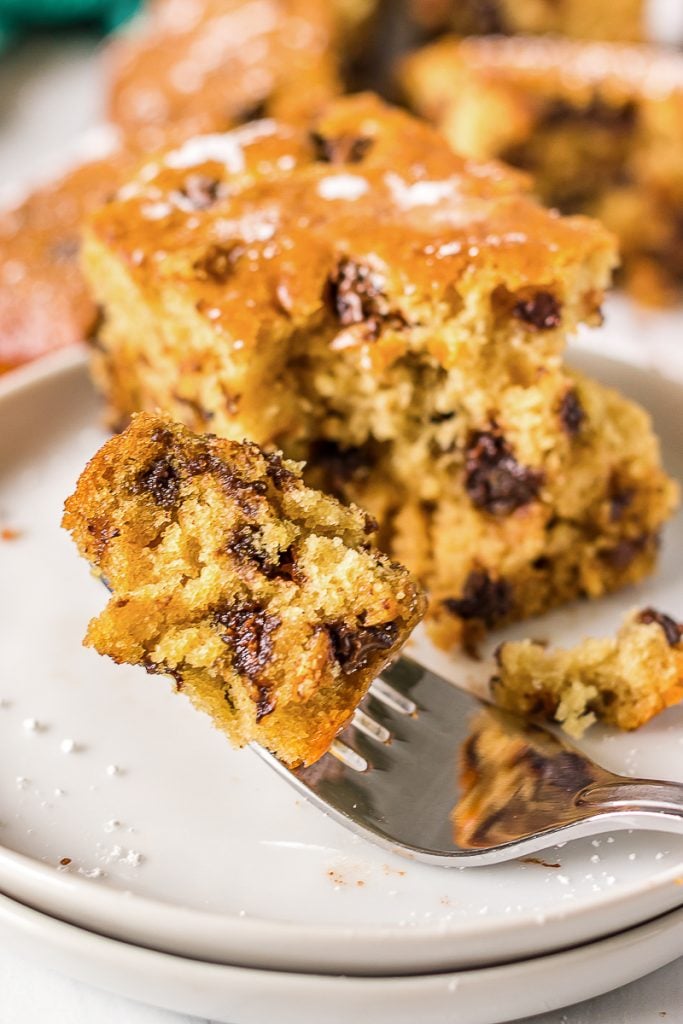forkful of cake on a white plate