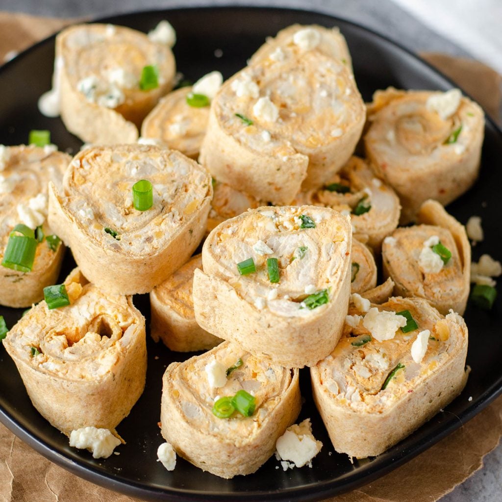 platter of buffalo chicken pinwheels stacked up