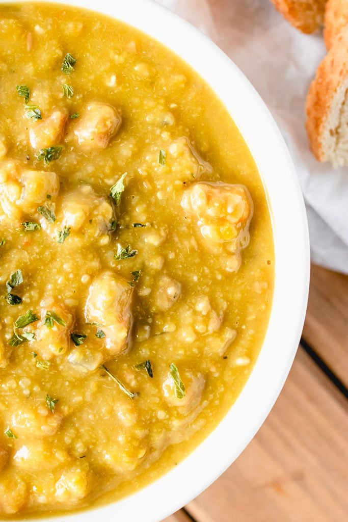closeup overhead shot of split pea soup in a white bowl