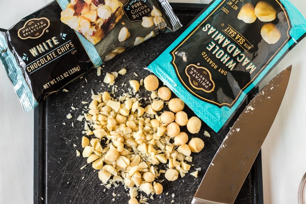 macadamia nuts poured out onto a cutting board