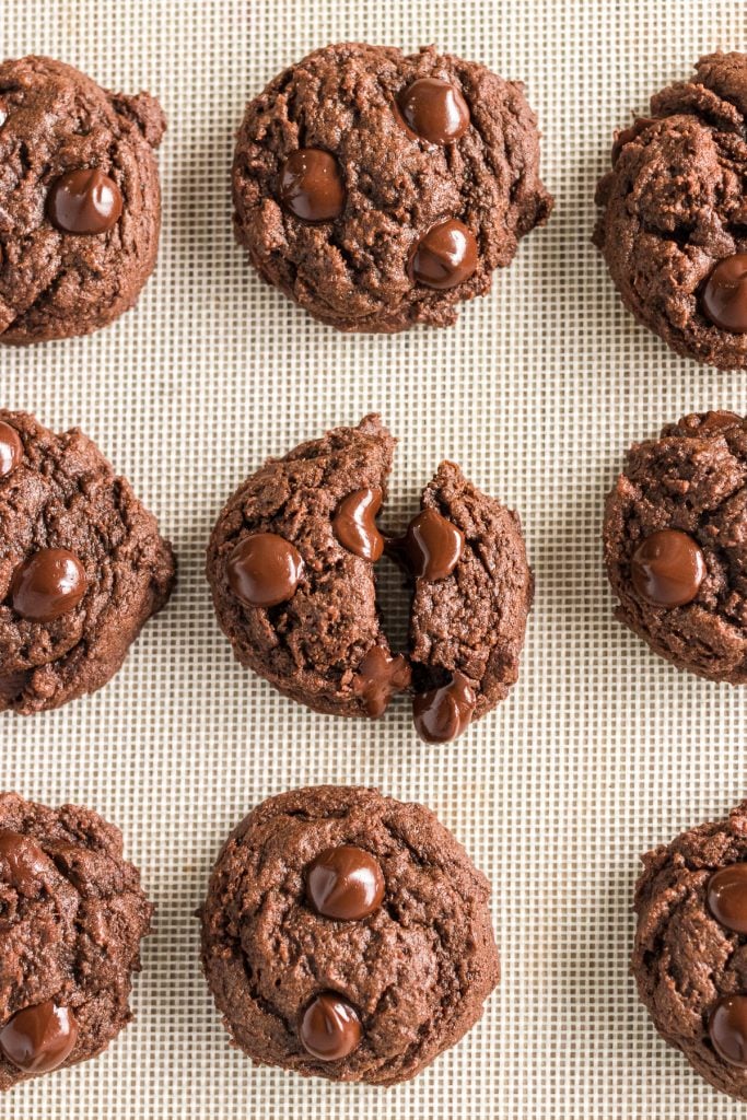 overhead shot of chocolate cookies on a baking sheet