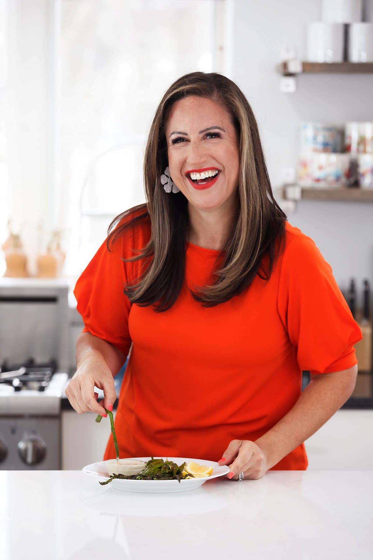 Liz eating broiled asparagus