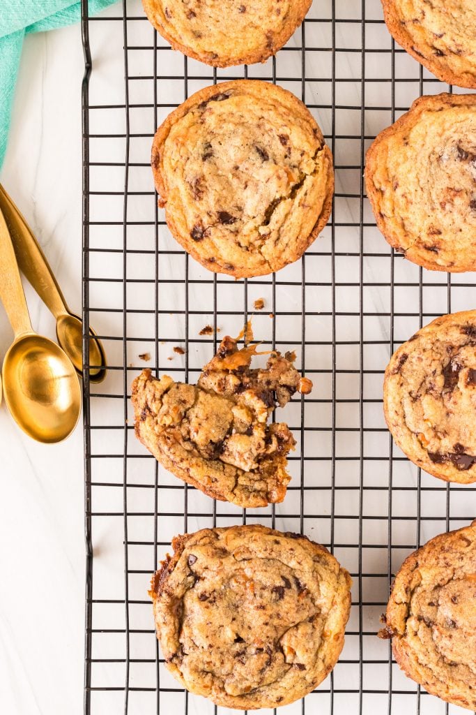 overhead shot of cookies on a cooling rack with melted caramel