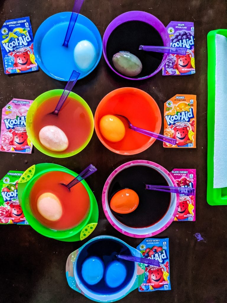overhead shot of eggs in kool-aid to dye them