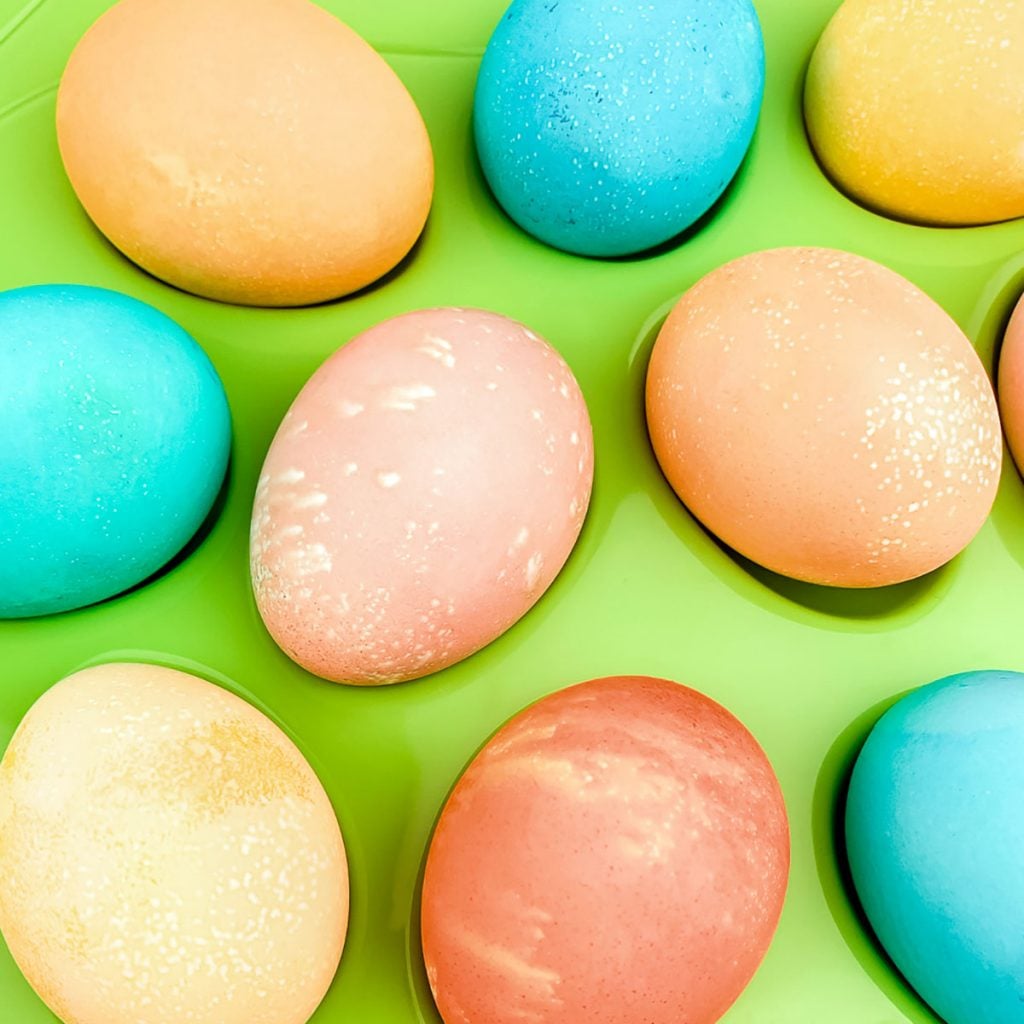 closeup of rainbow colored easter eggs